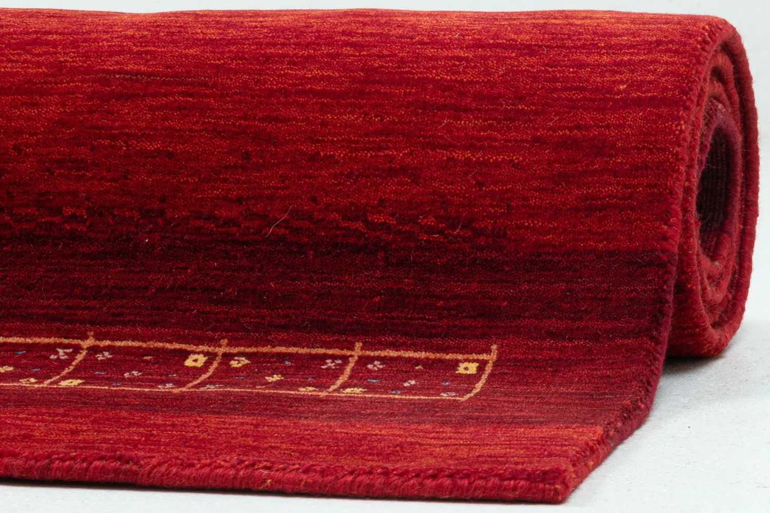 THEKO Lori Dream Gold Teppich 90x160 cm Rot Schurwolle